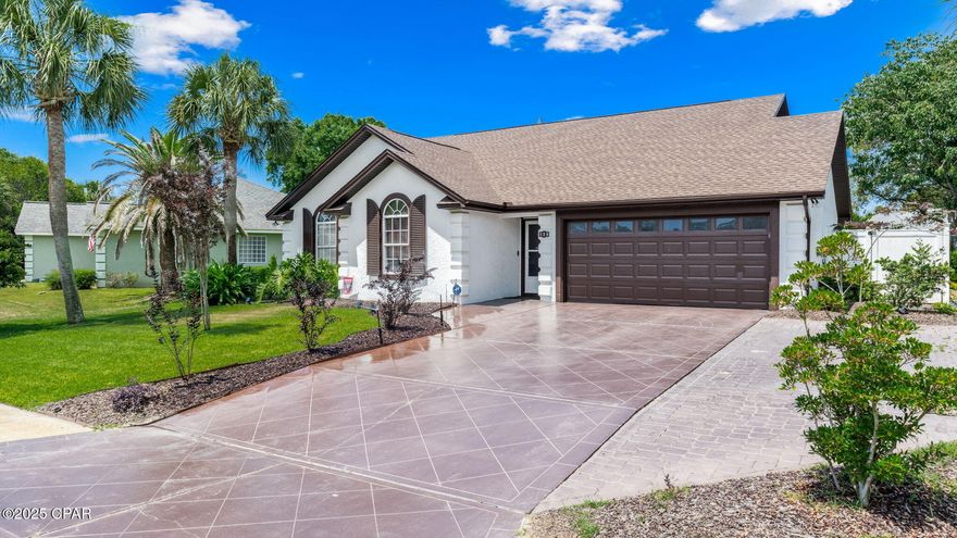 Welcome to 128 Summer Breeze Road!This home has been given major ''LOVE'' with exterior repaint (2021), interior repaint (2020), LVP flooring (2021), new roof (2019), privacy fence (2021), huge pool cage (2021), HVAC (2021), tankless water heater (2022), pool heater (2022) replaced pool pump (2023), gas firepit (2022), new refrigerator and gas stove (2025). The pool and garden area are  perfect for relaxing and entertaining family and friends. The lania is the perfect ''go to'' spot for that morning cup of coffee or late evening beverage while winding down from the day! If you are looking for a primary home or a second ''get away home'', you're gonna want to see this for yourself! This golf cart friendly community is a highly sought after neighborhood that is a low traffic, quiet setting and yet just a very short walk (1 block) or 5 minute golf cart ride to the beach, a 5 minute drive to Pier Park and McGuires Irish Pub is literally next to the back gate entrance! This home is being sold COMPLETELY FURNISHED as seen in the photos with very few excclusions being the piano, horse bench, glass golf table, golf memiorbilia, puzzle pictures, books and antique sewing machine & night stand, 85''TV. You will truly be walking into a total READY TO LIVE IN BEACHSIDE RESIDENCE scenario! Homes in this community are on Buyers watchlist and sell quickly! Make your appointment to see this property ASAP!