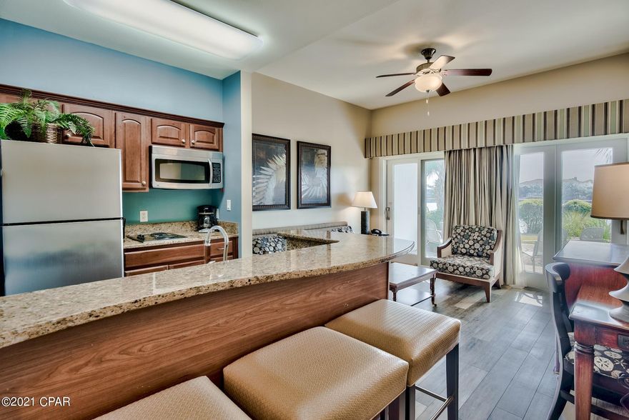 Carillon Beach Inn is perfectly located on the west end of Panama City Beach with quick access to Pier Park, Northwest Florida Beaches International Airport (ECP), Lake Powell, and all that 30A has to offer. Take advantage of all the great amenities in Carillon Beach Resort with over 3,900 ft. of sugar white sand beaches, 4 community pools, 2 hot tubs, tennis, yoga studio, fitness center, retail shopping & dining at Carillon Market Street. Enjoy outdoor activities such as bike rentals, kayaking, paddle boarding, snorkeling, fishing and much more. Unit 212 is a second floor unit with direct access to a balcony with serene views of Lake Carillon. This unit features luxury vinyl plank flooring throughout with tile in the kitchen & bathroom. The kitchen features granite countertops, stainless steel appliances, and a great breakfast bar. Several large sliding glass windows give the unit great natural light and beautiful outdoor views of the lake can be enjoyed from the common areas. The bedroom features a king bed with recessed lighting above. This condo would make a fantastic rental investment or private beach getaway!