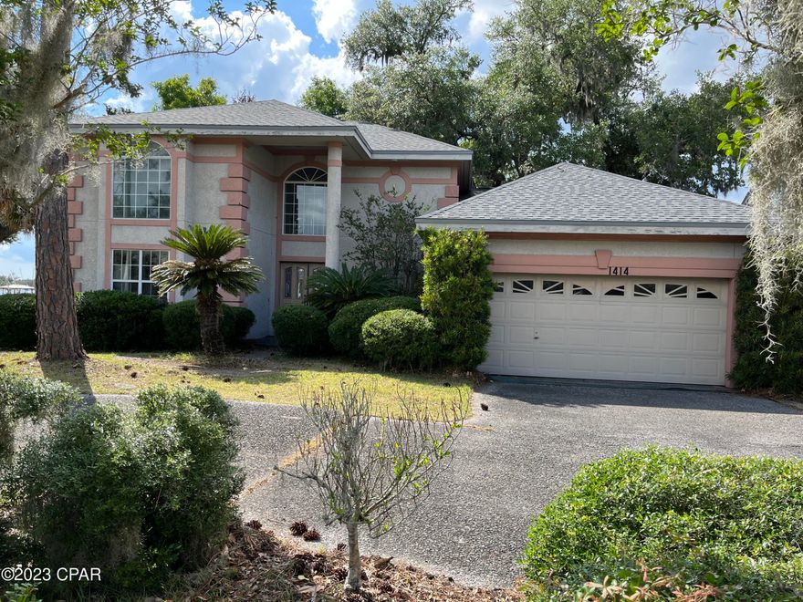Currently Under Contract, seller will consider back up offers. BAYFRONT IN THE COUNTRY CLUB!!  Your chance to re-design a beautiful home on an outstanding bayfront lot. Home remediated  and gutted and new roof immediately after Hurricane Michael to protect from further  damage.  Well built home waiting to be be re-done just the way you want.  Only known hurricane damage other than water was a large opening in roof and one broken window. Master and den  ( could be used as 4th BR on first floor.  Two bedrooms and full bath on second.  Most of rooms have bay view. Home has been under Sentricon  termite bond for years and is not in a flood zone.  wood burning fireplace with gas starter as well as gas to outside grill on deck.  large deck and walkway with gazebo platform all need to be rebuilt.  Now is the chance as investor, or owner to  make this a dream home to enjoy gorgeous sunsets and dolphins!  Seller holds a Florida real estate license.