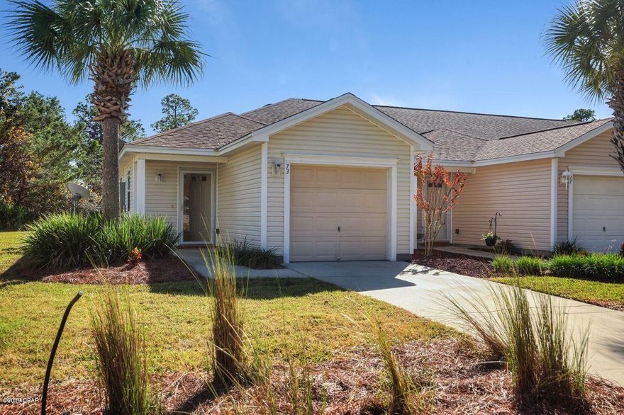 Beautiful end unit townhome in Palmetto Trace next to a large green space. This 2BR/2BA unit comes with a 1 car garage, and patio overlooking the preserve area. The open floor plan townhome features laminate wood flooring in living and dining areas, both bedrooms and hall, the kitchen and baths have tile floors. Living area includes a built -in electric fireplace. Eat- in Kitchen features granite counters, stainless appliances, wood cabinets, and a breakfast bar. The master suite includes bathroom with double sink vanity and a large walk-in closet. Washer and dryer convey with the home.  This is almost maintenance free living; HOA fee covers lawn care, irrigation, termite bond, annual pressure washing, twice a year pine straw application in yards, and trash collection. Palmetto Trace features tree lined street with sidewalks and streetlamps. The community includes 2 swimming pools with open air pavilions and bathhouses. Palmetto Trace is conveniently located a short ride or walk to Pier Park, Frank Brown Sports and Entertainment complex, Gayle's Trails, and the world's most beautiful beaches and Gulf of Mexico. You can live, work, and play all in the same area. 

All room sizes, square footage, lot sizes are approximate; buyer to verify if important.

Buyer to pay St Joe charity fee- 1/2% of of purchase price