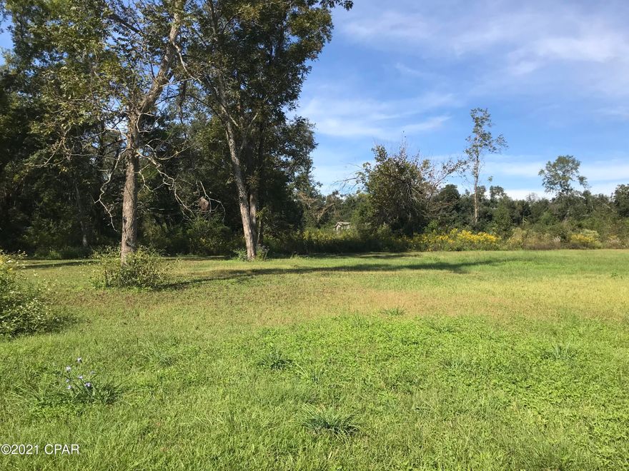 PRICE REDUCTION.   Searching for a great property to build your dream home on & already have a large 18' x 20' barn for a workshop & storage?  This is the place for you.    5.0 acres more or less located along a main paved highway between Marianna, Fl. & Cottondale, Fl.  Part of the acreage in the back is fenced with livestock grazing on it.  The barn was erected on the property & has a concrete foundation/flooring.  Sign is in front of the property.