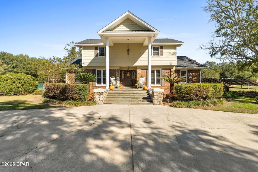 Just around the corner from The Baptist College of Florida, this beautiful two-story home in the City of Graceville offers the perfect blend of comfort, charm, and modern convenience. Located on a lovely property featuring a grid-tied solar system, this home enjoys remarkably low electric bills. A new roof, plantation blinds, and many recent updates add to its appeal, while the refreshing saltwater pool with multi-color lighting creates a stunning nighttime ambiance—perfect for relaxing or entertaining.

Inside, you'll find a warm and inviting layout that includes a formal dining room, a cozy breakfast area, and a dedicated office ideal for working from home or managing daily tasks. The kitchen offers plenty of counter space, abundant cabinetry, and modern appliances, making it a joy to cook and gather in.

Upstairs, two bedrooms share a convenient Jack and Jill bathroom, along with a small entertainment room that makes a great play area, TV space, or reading nook. Each bedroom includes spacious walk-in closets, providing generous storage.

The home has been thoughtfully maintained for comfort and efficiency, featuring upgraded HVAC systems, an encapsulated crawl space, and a newer hot water heater. Additional features include a security system with exterior cameras for peace of mind and a termite bond for added protection.

Outside, you'll appreciate the paved road frontage and circular driveway, along with a spacious 20x40 workshop featuring a concrete foundation and garage door—perfect for hobbies, storage, or projects. The backyard is a true retreat, complete with a firepit, playground equipment, and space for a large garden. The pool area provides plenty of room for entertaining, and the fireplace remains under warranty for added reassurance.

Offering a lifestyle that blends functionality, security, and relaxation, this Graceville gem is ready to welcome its next owners.