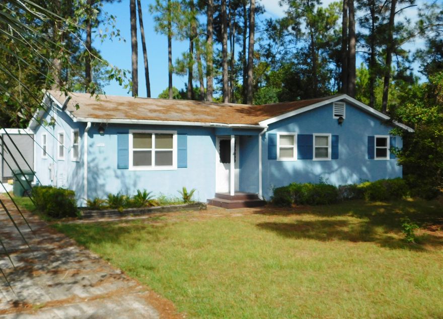 In the heart of desirable Lynn Haven!  Just minutes to shopping, schools, restaurants and medical facilities.  Home is situated on a large .34 acre tree shaded lot with partially fenced back yard, storage building and screened back porch for lazy evenings!  3 bedrooms and 2 full baths, separate main living room with dining room/den combo just off kitchen.  Possibility there are hardwood floors under the vinyl/carpet but have not confirmed.  This doll house just needs a bit of TLC to shine again!  Call your REALTOR today for more info.