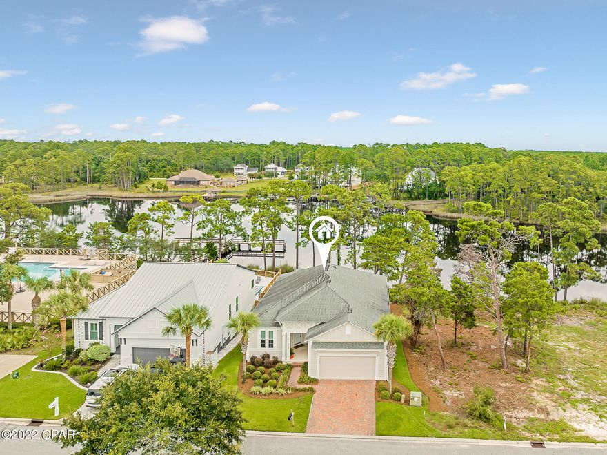 Stunning waterfront home on beautiful Lake Powell. Enjoy the serenity of coastal dune lake living in this newly remodeled and extremely spacious home. The lot is primed and ready for the addition of a private dock. Located very close to the community clubhouse/pool/dock, this 6 bedroom home offers a multitude of living arrangements. From the living room to the decks, you will find the perfect combination of both indoor and outdoor living to absorb the gorgeous water views. Recent updates include but are not limited to flooring, kitchen, baths, interior/exterior paint, shades, and new heating and air units. The main level is comprised of a 2 car garage, formal dining room (also good for office conversion or den),open concept kitchen/living/dining, water front master bedroom/bath, 3 additional bedrooms with shared bath, and the main level laundry. The lower level includes an additional kitchenette, waterfront living room with walk out patio, 2 bedrooms with additional bath, huge finished flex space perfect for home theatre/gym/game room, additional laundry, and spacious storage room. Poured concrete walls on the lower level combined with hard-plank exterior help solidify this beautiful home. Turtle Cove offers a multitude of amenities from the pool, tennis courts, clubhouse, and dock. Enjoy this very convenient location in close proximity to Sharks Tooth Golf Club, beautiful Bay County and South Walton beaches, Pier Park, and the east end of 30A.