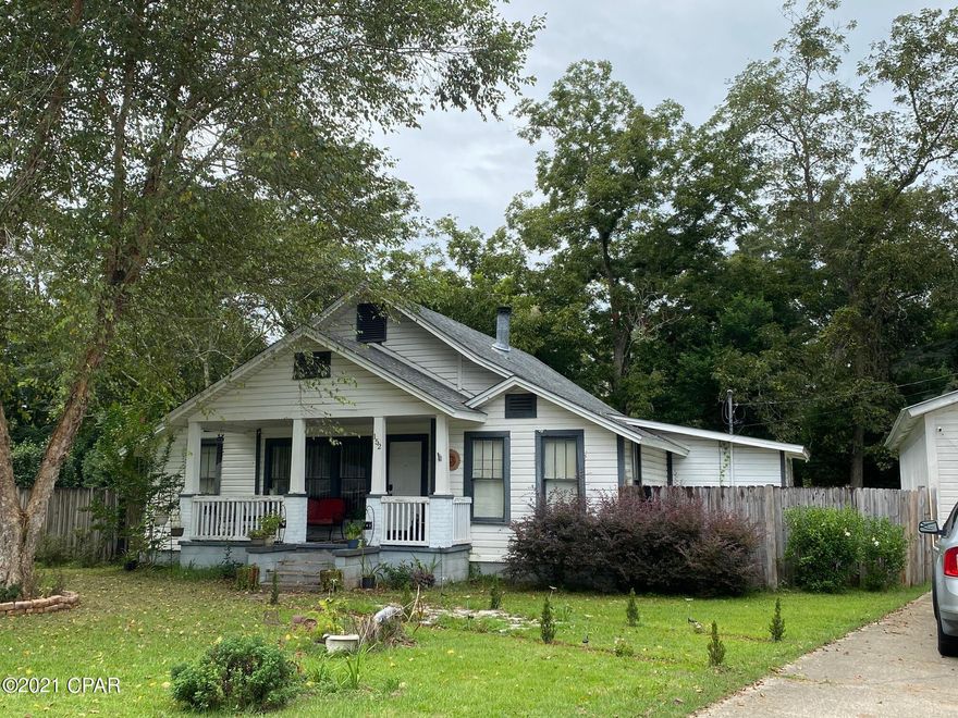 Originally built in 1935 this home is full of character!  When you step in the front door, you're greeted with beautiful hardwood floors and a brick wood burning fireplace.  The den has a gas fireplace and charming tongue & groove wood ceilings.  The L shaped kitchen has ceramic tile counters and lots of cabinet space.  Split bedroom floor plan with nice size bedrooms.  The large back porch overlooks the fenced back yard - perfect for your family gatherings.  The 2 car detached garage has a workshop area and a loft for storage.  Plus another storage building. The sprinkler system is on a well!  All of this sits on .847 acres!!  New roof in 2018.  New HVAC in 2015.  This home is ready for you!