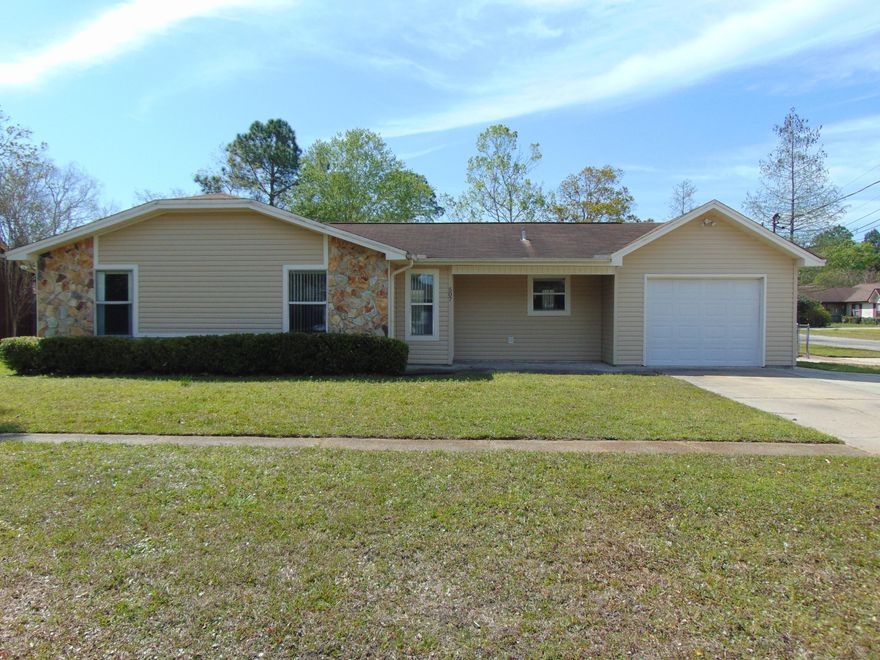 3 bedroom, 2 bath home on large corner, 1 car garage, large driveway for extra parking, tile floors, living room w/vaulted ceiling, covered patio & chain link fenced backyard.