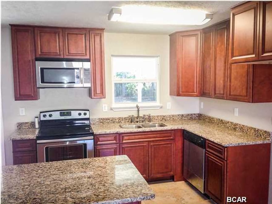 I am 6408 Lance, when my current owners found me I WAS in sad shape, luckily they are seasoned renovators that brought me back to life and truly MOVE IN READY....Can you believe I was only just built in 1996, I'm completely renovated and I have 4bd 2ba, a large back yard AND a garage all for such a GREAT PRICE!! Look at my roof with 30 year dimensional shingles. I have freshly paint walls and ceilings in every room. I have beautiful 20'' porcelain tile in the great room, hallway and bathrooms, and brand new carpet in the bedrooms. My Kitchen features new all wood cabinets, granite counter tops, an under mount sink, an island/breakfast bar, and of course new stainless steel appliances. My bathrooms feature new vanities, new toilets, new lights, new mirrors, new faucets and new