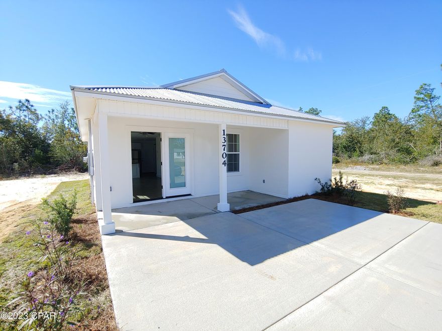 Brand New Home! Concrete block construction with metal roof, open concept living area, and covered front porch. Low Maintenance and stylish concrete floors, recessed lighting, new stainless appliances, Formica countertops, and breakfast bar. Features new septic, concrete driveway, new water well, low-E windows, High Efficiency HVAC System. No HOA. Quiet area North of Panama City near Hwy 231 and Hwy 20. 30 Minutes to Panama City, 40 Minutes to Panama City Beach. Exact colors and materials may differ. Buyer to verify all details.
