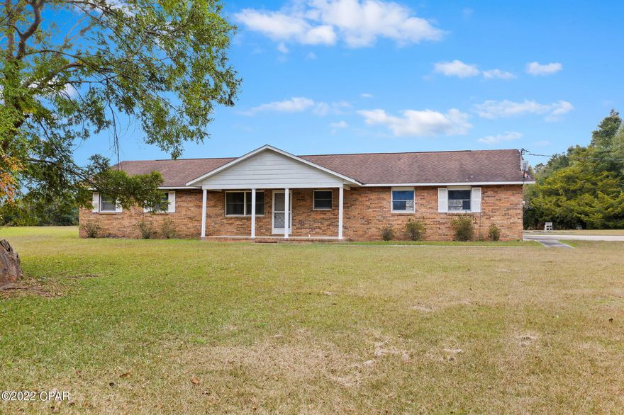 This brick beauty is perfectly situated on a quiet 1.5 +/- acres and awaiting its new owners! Inside you will find a spacious living room with custom built-ins, 2 guest bedrooms, full bath and a master bedroom with en suite bath.  Outside features include attached 2-car garage with shower, covered front porch and 22x10 screened porch. Home is located in the Orange Hill community, a short drive to Interstate 10, Hwy 231 and Hwy 77.