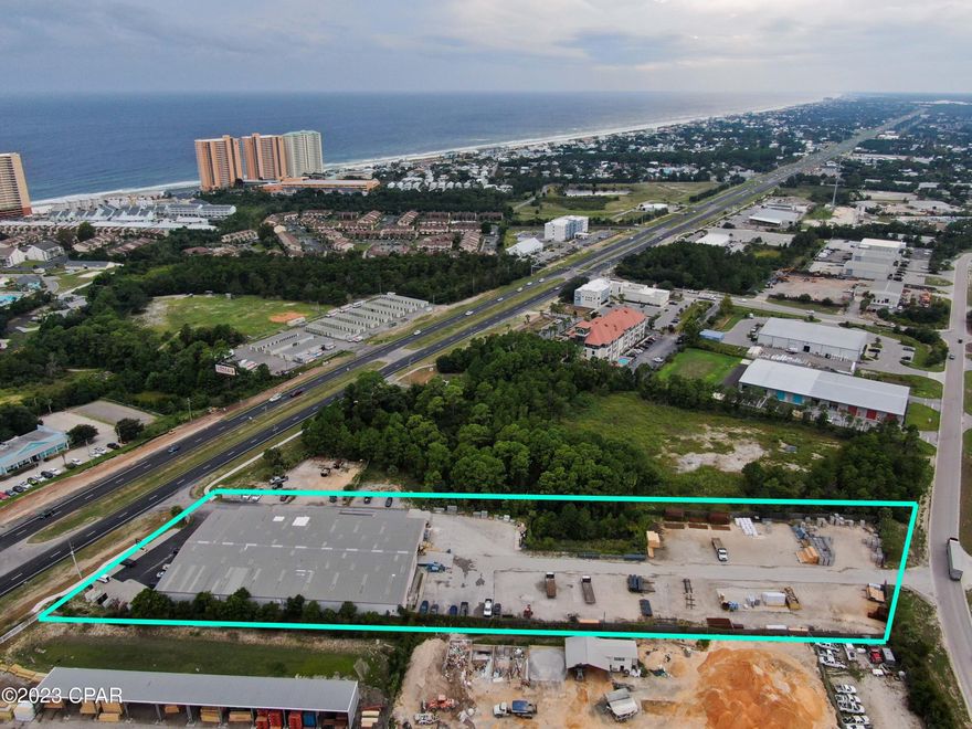 Presenting a prime commercial real estate opportunity: A spacious 33,000 SQ. FT. building nestled on an expansive 3.5-acre lot, boasting an impressive 225' of frontage along the prestigious Panama City Beach Parkway. This property offers unparalleled visibility and effortless accessibility, thanks to its strategic location with direct access via the Parkway, a convenient median cut, and an additional rear entrance accessible from Ashley Drive within the esteemed Beach Commerce Park.

Constructed in 1996, this versatile building holds a dual zoning status, with a commercial designation for the front portion and a Light Industrial zoning for the rear. Inside, you'll find a generous 16' eave height, perfectly suited for various business needs. For logistical ease, the property features 3 loading bays, each equipped with 14' x 16' roll-up doors. Moreover, a substantial 20' x 16' loading door with a ramp enhances accessibility on the Northside.