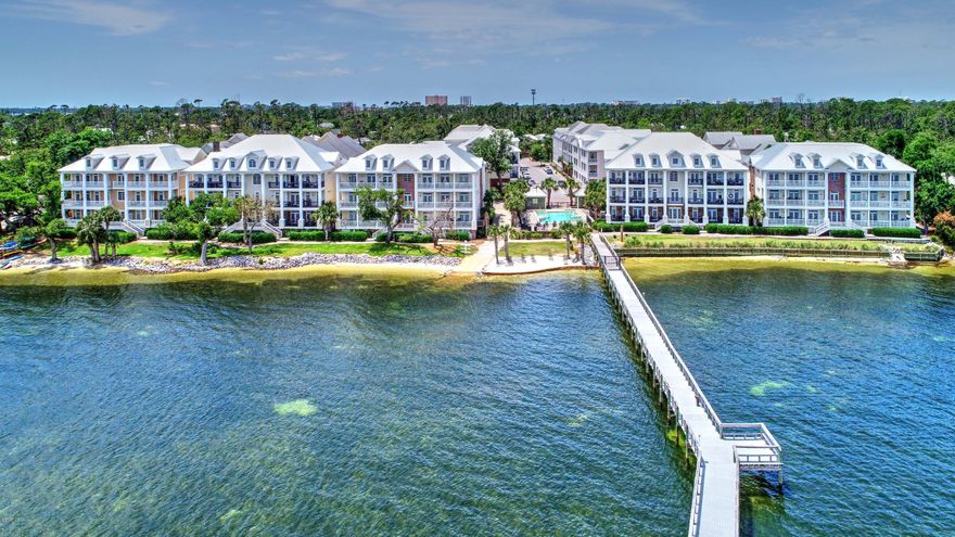 Waterhaven condo on the desirable first floor, with water views!  If you are looking for turnkey and upgraded - this is the home for you!  Easy one story living and floorplan perfect for entertaining.  Features hardwood floors, crown molding, solid wood cabinets, Viking Professional gas range and hood, Sub Zero refrigerator, wine refrigerator, separate ice maker, and an expansive island perfect to dine, prep, entertain, or sit and just relax. You have bay views from some windows, and the best views from your porch, where you can enjoy morning coffee or evening cocktails looking at the water! Waterhaven amenities include bay front pool, dock, Owners Club, gym, theatre, greenspace, sidewalks, all in a gorgeous setting on St Andrew's Bay.  Extra storage closet outside the unit.