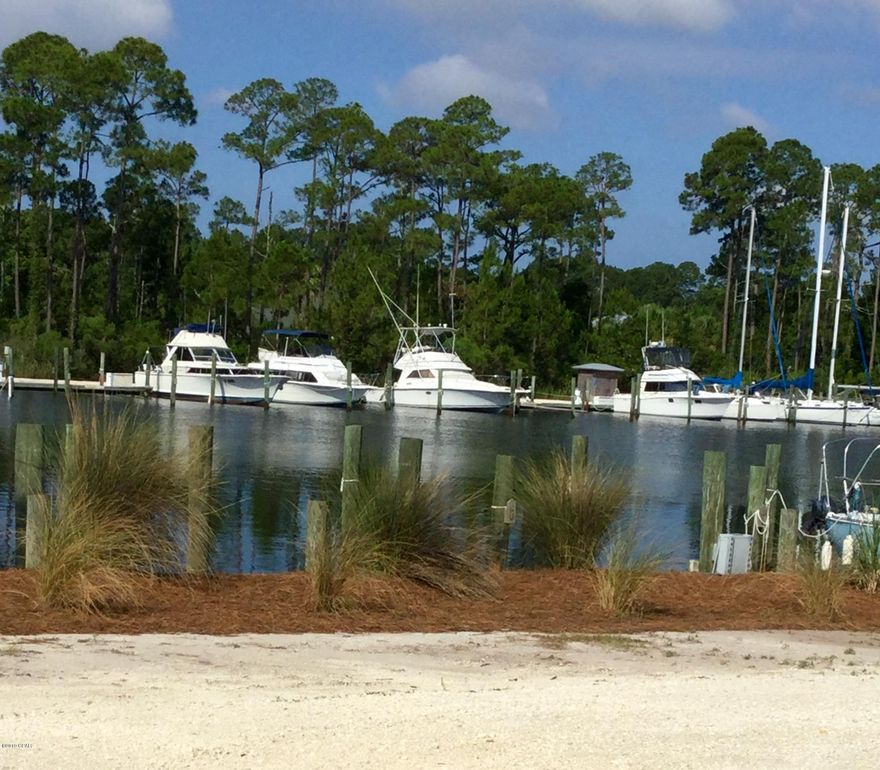 Looking to build a home in this beautiful community! Here is the opportunity!  This lot is located in the prestigious Gated, Bay Front and Marina community of Dolphin Bay. The planned community has a deep-water marina with slips for rent or sale and a boat ramp for easy access to North Bay, the Inter-coastal waterway and the Gulf.  Fenced/lighted tennis courts are provided for the sports minded.  THE AMENITIES AND LOCATION OF THIS LOT CANNOT BE OVER STATED - Dolphin Bay is centrally located between the ''Beach'' and Panama City/Lynn Haven, with convenient access to the Navy base, beaches, schools, restaurants, shopping and entertainment venues.  Do not miss this PRICED TO SELL LOT!   All lot dimensions are approximate and should be confirmed by the prospective buyer prior to purchase.