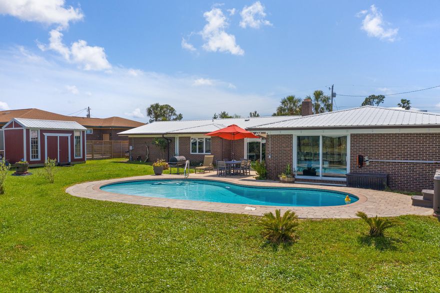 Rare waterfront opportunity in Lynn Haven's desirable Northshore! Updated 4 BR + office includes an in-law suite with separate access! This stunning home has been updated throughout the inside. Outside, there is a boathouse with lift, in-ground pool, hot tub, seawall in great condition, additional dock and large patio poolside. Deepwater with plenty of draft for larger boats and an easy ride to the Gulf with only a short distance of no wake zone. The private waterfront master retreat has direct access to the pool & hot tub, an enormous walk-in closet, large tub and beautiful tile shower in the bath. A completely remodeled kitchen features quartz countertops, high-end appliances and custom cabinetry. Don't miss out! Call your favorite agent today!