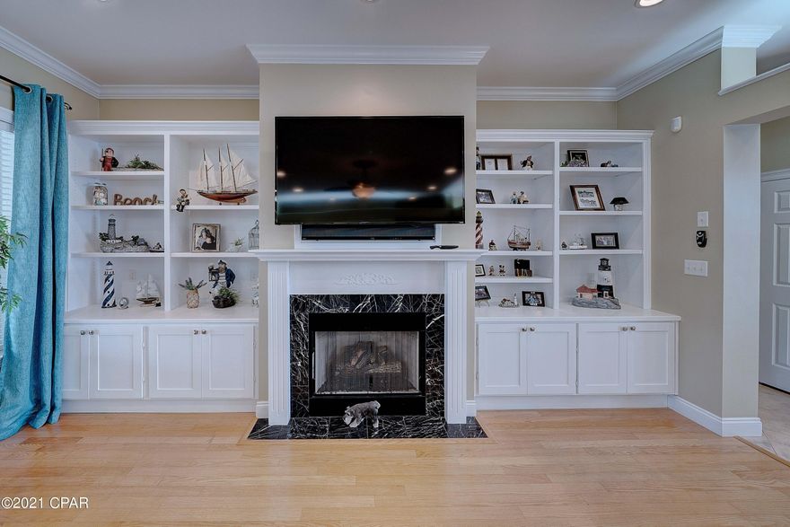 CURRENTLY UNDER CONTRACT, SELLER ACCEPTING BACKUP OFFERS - BEAUTIFUL BAY VIEW HOME and BOAT DOCK IN DOLPHIN BAY!

Included with this home, is a boat Slip with a lift

in the private Dolphin Bay Marina. This spacious home with Four Bedrooms plus Three Full Baths is move in ready.  The large family living area features hard wood floors and crown molding. This is a golf cart friendly community. Jump in your golf cart and ride over to the privite marina to visit your boat dock. The Boat Dock is 12.5 ft by 30 ft and features a 10,000 lb Boat Lift. The Boat Lift is equiped with a remote control. This makes it very easy to raise or lower your lift when you are docking.  The screened in patio is a great place to relax after taking a swim in the inground pool.  Mak