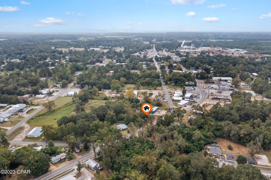 INVESTMENT OPPORTUNITY in the city limits of Graceville! Currently used as a rental and zoned General Commercial Use C2, this 2 bedroom/1 bath home has many possibilities. Property is sits directly on Hwy 77 and has an average daily traffic count of 3,600 (2022 DOT Data).