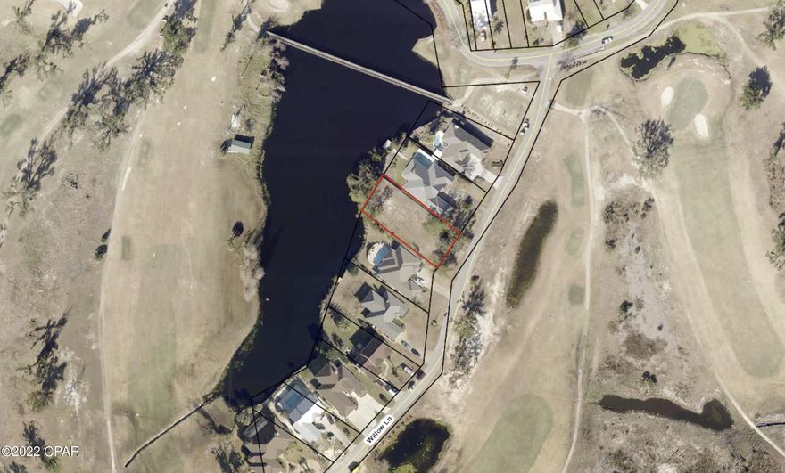 Residential lot on Willow Lane in the Panama Country Club.  Lot is cleared and ready to be built. Lots is adjacent to a pond on the Country Club's golf course.