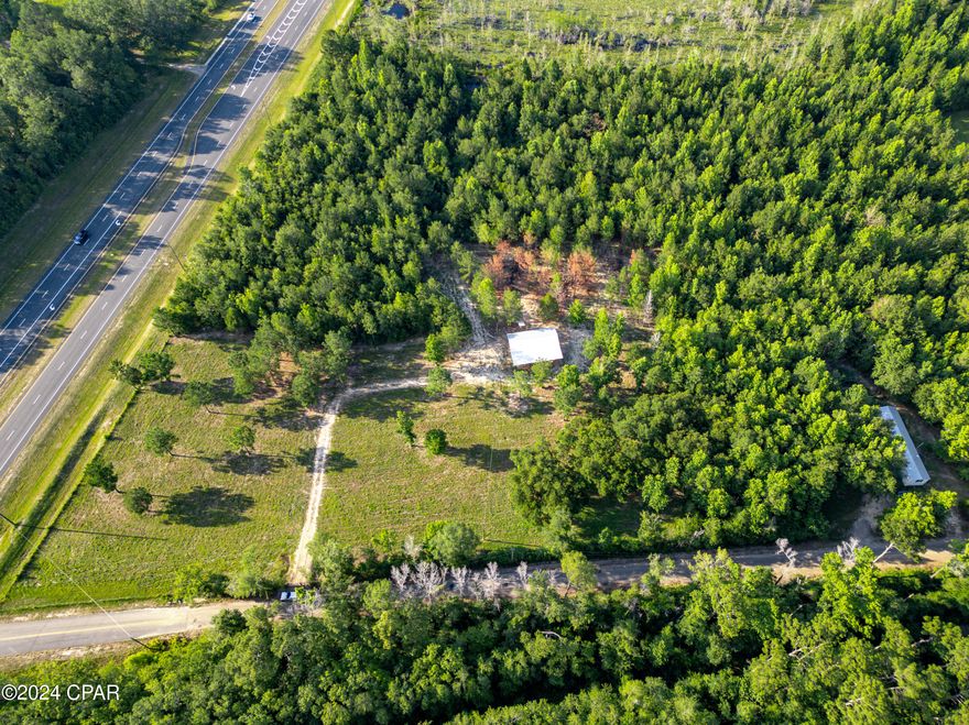 The property consists of two lots, separated by a right of way (DOT). The total acreage is 10.57 acres. The northern most lot is located directly across from Coy Rd.

Property is approximately 6.5 acres with the Pole Barn, New Well & Power Pole. The other approximate 4 acres is partial dry that sits on Cobb Bay Pond.