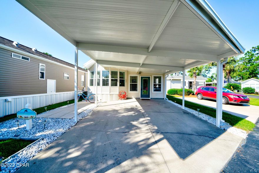 This is your opportunity to own a beautiful, turnkey unit at Emerald Pointe Resort, one of the highly sought-after communities in Panama City Beach. The home is beautifully furnished and decorated, with recent updates including: LVP flooring throughout the home, shiplap accent wall in living room, barn door leading to the master, new window treatments, a kitchen island with a butcher block top and new furnishings. The home features 2 full-size bedrooms, 2 bathrooms, large addition with living room, 2 lofts for added sleeping quarters, updated kitchen with new cabinets, Corian counter tops, deep double-sided sink, tile back splash, stainless steel appliances, and a storage / laundry room. Additional updates also include: Roof and carport replaced 08/2018, 50 gallon hot water heater, Cont... AC replaced 2017, and a water purification system. The home is move in ready and is being sold mostly furnished. Ask your agent for the small list of items excluded from the sale. This home has not been used as a rental. (Professional Pictures Coming Soon)
Emerald Pointe Resort is a golf cart friendly, gated community located in the heart of Panama City Beach close to restaurants, shopping, and the world's most beautiful beaches. Amenities include a large clubhouse, exercise room, 2 pools (one heated seasonally), hot tub, lake with boardwalk, and shuffleboard court. HOA fee includes water, sewer, garbage, cable, and lawn service. All information is approximate and should be verified by buyer if important.