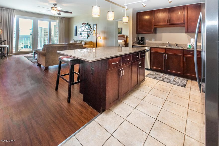 The spotlight has stopped here! Enjoy spanning gulf views from your oversized private balcony. This unit features NO carpet, gorgeous dark flooring, granite countertops, stainless steel appliances + more! This unit historically boasts the best rental numbers in Laketown Wharf - $35,000+ in 2019. The unit features 2 oversized bedrooms + an additional bunk room. The master bedroom features a private entrance to the balcony. Your family and guests will love the most comprehensive set of amenities. Five pools include one zero-entry pool overlooking the Gulf of Mexico, a tenth floor rooftop pool, and an island pool secluded at the middle of a private lake, private deeded beach access, 52,000 sq. ft. of lakefront boardwalk, fully equipped fitness center and covered parking. You'll love it here!