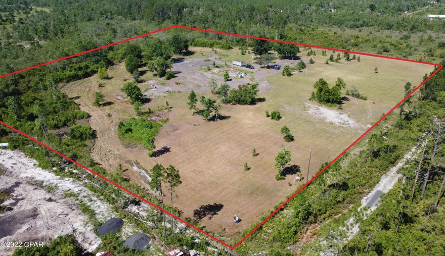 While others want an arm and a leg, need clearing, a well and power, this 10+/- acres has power and a well! The property also has approximately 24x48 concrete slab with anchor bolts.  It has it all without the stiff price tag. Wild and planted blueberry bushes, mulberry trees, several small citrus trees, and a few small pecan trees. DO NOT WALK THE PROPERTY UNLESS ACCOMPANIED BY A REAL ESTATE AGENT. Only 35 minutes from CWR (formerly GAC contractors) on HWY 231