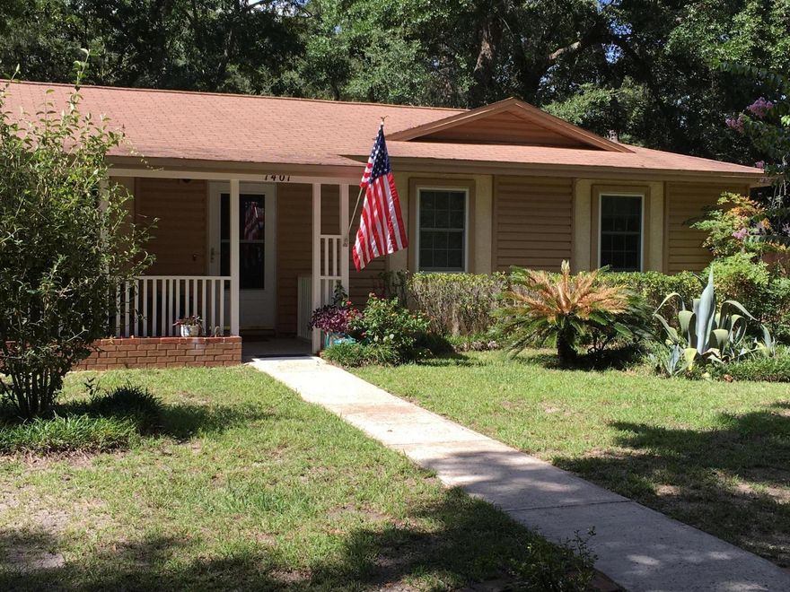 This very well cared for home has modern windows, recent appliance upgrades, fresh paint, a very private back yard all on a very large secluded lot in Southport.  You will not be disappointed in this home for the money.  Open floor plan with kitchen bar seating for 6. Florida room makes for great evenings in the back yard and the country style porch makes for great morning coffee time.  The driveway has concrete curbs holding the driveway that makes a half circle from 3rd to Madison will have plenty of parking if you like to entertain.  Fruit bearing trees in the yard including a fig tree.  The large yard is landscaped for minimum maintenance, maximum privacy, and you should expect humming birds to visit these flowers. Transferable termite bond since it was built.