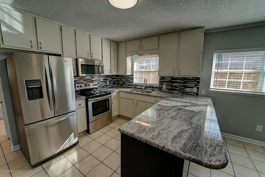 All new granite countertops, stainless steel appliances, microwave range hood, side by side refrigerator with indoor ice dispenser, new living room floor, new granite top bathroom vanities, new carpet in the bedrooms!!! Large Living, Kitchen & Dining room! Privacy fenced yard, 2 car garage! This home is completely move in ready.