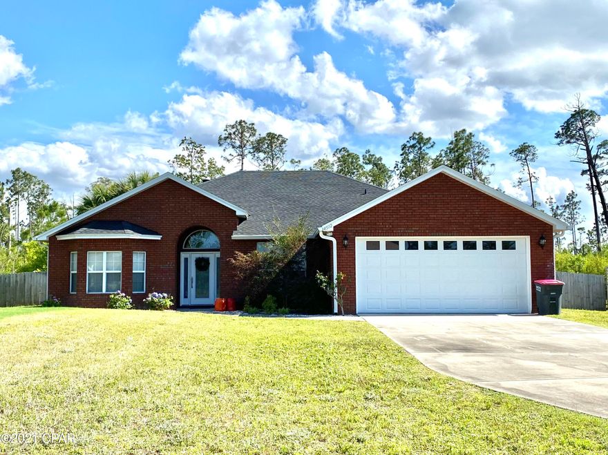 CURRENTLY UNDER CONTRACT, SELLER ACCEPTING BACKUP OFFERS! This beautiful, CUSTOM BUILT 4BR/2BA brick home sits on over .50 acres with a HUGE FENCED IN BACK YARD and stunning 25K-gallon HEATED SALT WATER POOL. Perfect for entertaining or relaxing with friends & family, this GORGEOUS open floorplan home features vaulted ceilings, LVP & tile flooring, and a lovely brick wood burning fireplace with beautiful mantle in the large GREAT ROOM. The spacious EAT-IN KITCHEN is complete with all stainless steel appliances, beautiful real wood cabinetry that offers a plethora of space for storage, tons of counter space, and a large walk-in pantry. The FORMAL DINING ROOM has a trey ceiling, brand new LVP and could also be used as an office or play space. The home boasts a fantastic SPLIT FLOORPLAN with the large MASTER SUITE and additional bedroom on one side of the home and the other 2 bedrooms nestled on the other side of the kitchen. The BEDROOM sitting adjacent to the MASTER SUITE features French doors, a large bay window and could also be used as an office, play space, sitting room, or nursery, as it is equipped with an additional set of large double doors that lead to the MASTER SUITE. The MASTER SUITE is quite spacious and such a relaxing retreat, as it has trey ceilings and an en-suite bathroom featuring a whirlpool tub, a separate shower, a large walk-in closet, and private toilet area. The other 2 BEDROOMS sit on the other side of the home, adjacent to a FULL BATH, and are both roomy with nice closets offering plenty of storage space. The laundry room, featuring a Samsung HE Front-Loading Washing Machine and Dryer set rests by the garage and is the perfect space for ditching all of the day's wet towels and clothes from your time out on Deer Point Lake, the beach, or even hours hanging out in the lush backyard in the huge HEATED, IN-GROUND, 25,000-gallon SALTWATER POOL or HOTSPRINGS HOT TUB. The beautifully manicured backyard is an absolutely phenomenal relaxing oasis with palm trees, orange trees, beautiful white rock, tons of open grass, and a large concrete patio area for entertaining--it is the most perfect place to enjoy your morning coffee or unwind after a long day. The home has so many upgrades and includes many fantastic extras: brand new seamless gutters around the entire house (2021), brand new LVP flooring (2021), brand new HotSprings Hot Tub (2021), Jacuzzi JSeries Professional Grade Heat Pump and Electric Pool heater/heat pump (2020), stainless steel side-by-side refrigerator in the garage, all pool equipment (including a motorized Polaris pool vacuum cleaner AND the large pool equipment storage containers), Samsung HE Front Loading washer and dryer set, Nest Smart Home Thermostat, Water Softener and Water Filtration System, SimpliSafe Alarm Security System, and Surround Sound speakers in the family room and backyard covered patio.

Located only 2 minutes from the High Point Public Boat Launch on Deer Point Lake, 6 minutes from the North Bay Launch at the dam, 25 minutes from Tyndall AFB, 20 minutes to ECP Airport, and only 10 minutes to major shopping, this home is perfectly situated away from the hustle and bustle of the city, yet is convenient to everything. This property won't last long--it is in supreme condition and has both a clean home inspection report and clean WDO report! Make an appointment to view it today!

All measurements are approximate. Please verify if important.