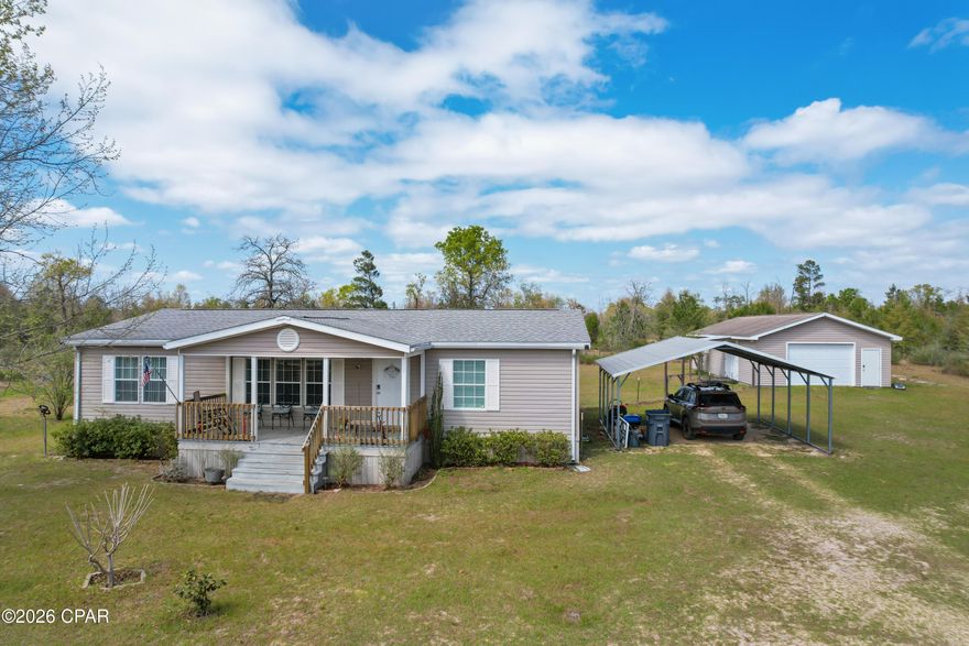 Charming 3 Bed, 2 Bath Country Home on 2.5 Acres -- Move-In Ready & Wonderfully Maintained
Welcome to this beautifully kept manufactured home nestled in a peaceful country setting on 2.5 fully fenced acres. This inviting split floor plan offers comfort, space, and a touch of rustic charm.
Step onto the lovely covered front porch -- perfect for relaxing and enjoying the quiet surroundings. Inside, you'll find a bright, open layout featuring a spacious living room with vaulted ceilings and a generous dining area. The kitchen is a standout with stainless steel appliances, attractive cabinetry, and plenty of room to cook.
The large primary suite includes a roomy ensuite with double vanity, quartz countertops, a shower/tub combo, and a great walk-in closet. Two additional adorable bedrooms -- one with its own walk-in closet and a built-in office/study nook -- provide flexibility for family, guests, or hobbies. A conveniently located laundry room sits just off the kitchen.
But the property itself is the real showstopper. A 24' x 48' detached garage/workshop offers two separate interior spaces -- ideal for a gym, craft room, office, or whatever you imagine. You'll also find a carport, a 24' x 36' pole barn, and two outdoor sheds, giving you abundant storage and workspace options.
The land is fully fenced, with an additional fenced area perfect for pets. Seasonal beauty surrounds you with wild blackberries, blueberry bushes, and trees just beginning to bud.
This is a must-see property for anyone seeking space, tranquility, and a well-loved home with endless possibilities.