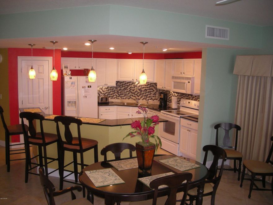 *PREMIUM GARAGE PARKING SPACE COMES   with this very desired 2BED/2BATH END UNIT with WRAP AROUND BALCONY! PARKING SPACE IS LOCATED UNDER WEST TOWER BUILDING. Enjoy the tropical Caribbean flair of Calypso Towers with their Tiki Hut Bar and 2 outdoor Gulf side pools. 1 is a heated pool! Unit has 9'ft ceilings and has been updated with new tile, wood laminate floors in bedrooms, updated kitchen with back splash and lighting. AND MASTER BEDROOM IS GULF SIDE! Tropical landscaping and on site fitness   for sale. Pier Park is just steps away with fabulous restaurants, shopping & entertainment.  On Rental program.