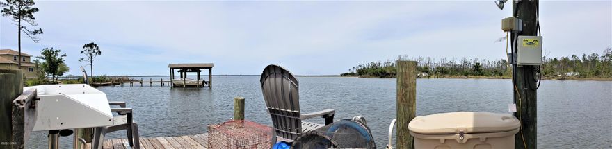 Rare opportunity to own a beautiful waterfront property to build your dreamhome on!  Quiet and peaceful waterfront neighborhood.  Lot  has water and power.  There is a large dock with covered boat lift and fish cleaning station. Deep unobstructed water leading out into the Bay and then the Gulf!  Beautiful sunsets!  There is a current appraisal and survey dated May 2021 given to seller by  previous buyer.  All important details should be verified by the appropriate specialist.