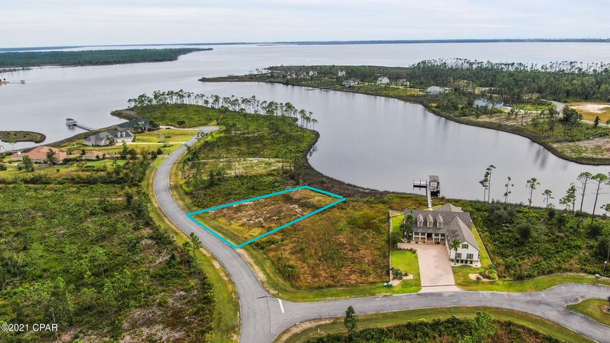 Build your dream home on this amazing water front lot in the beautiful gated community of Laird Bayou. This lot is dockable with deep water access and has stunning views of the East Bay. The community offers a pool, boat ramp and boat/RV storage. The neighborhood is surrounded by mature trees, gorgeous custom built homes and the warm waters of East Bay.  You feel like you are living in a county oasis but only about 15 minutes to Tyndall Air Force Base and minutes to restaurants, shopping, and more! Come build your water front dream home today!