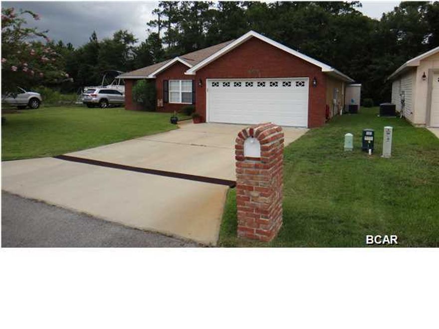 Beautiful brick, 3/2 home with solid bamboo wood floors (in all main living areas and the master) located on a cul de sac. The kitchen offers stainless steel appliances, garbage disposal, upgraded real wood cabinetry, accent lighting under cabinets, a purifying water filtration system, tiled backsplash and breakfast bar. The master bathroom features two walk in closets, two sinks and a tiled standing shower with two shower heads (each with independent water temperature controls). The home has crown molding, inside utility, the programmable 4-zone sprinkler system as well as the exterior faucets are connected to a well pump(saves monthly water costs), attic access, storage shed, 50 gallon programmable water heater and more. This home backs up to wooded property that cannot be built on.