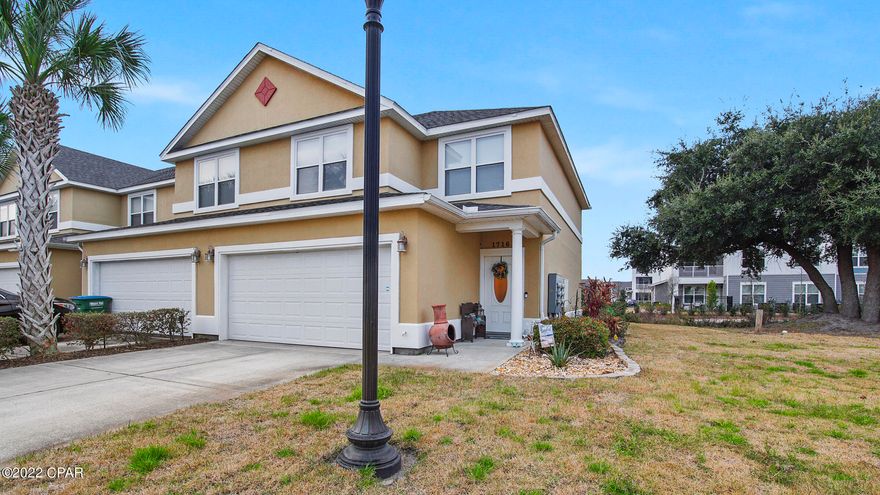 Beautiful end unit townhome in the wonderful gated community, Annabella's. Open kitchen with updated Stainless steel appliances, spacious dining & living room downstairs with half bath for your guests. upgraded cabinets & granite. French doors to the back yard with a beautiful paver patio, great for entertaining guests, or enjoying a nice cold drink in the warm summer evenings. Upstairs master suite with large walk-in closet, double vanity, garden tub & separate shower. Home sits next to a large open grassy area that works well for walking pets. Two car garage, with two parking spots in driveway. Centrally located with easy access to everything: Pier Park, Hathaway Bridge, beach! Community pool, fitness room, dog walking areas, ponds & fountains. Buyer should verify measurements.