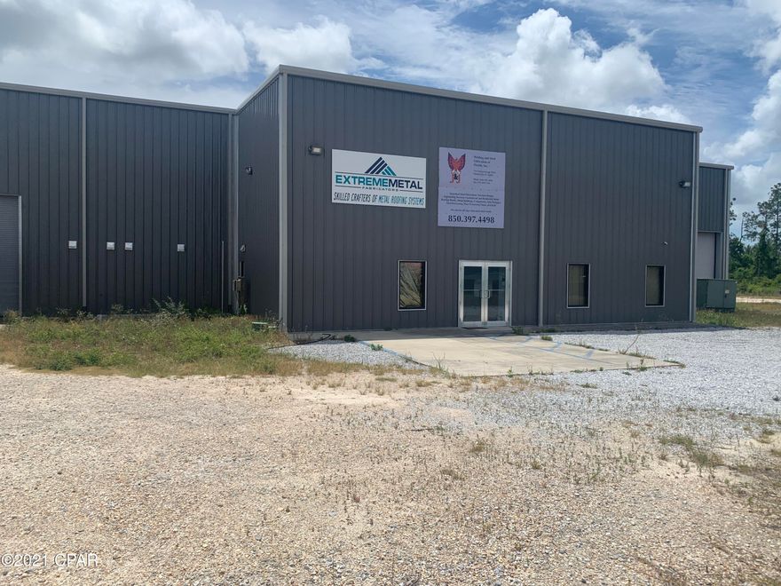 This is a great industrial building located very close to Highway 231 in northern Panama City.  The building was completely rebuilt after Hurricane Michael in 2018 and is in excellent condition.  The warehouse portion of the building is 6,720 square feet with six 12' roll-up doors.  The warehouse is also equipped with 2 15-ton bridge cranes. There are executive offices in the front with a reception area.  There are also production offices and employee break areas in the rear.  The 4.12 acre property is fenced and gated with plenty of room for expansion.  This property is also available for Lease, See MLS # 716108