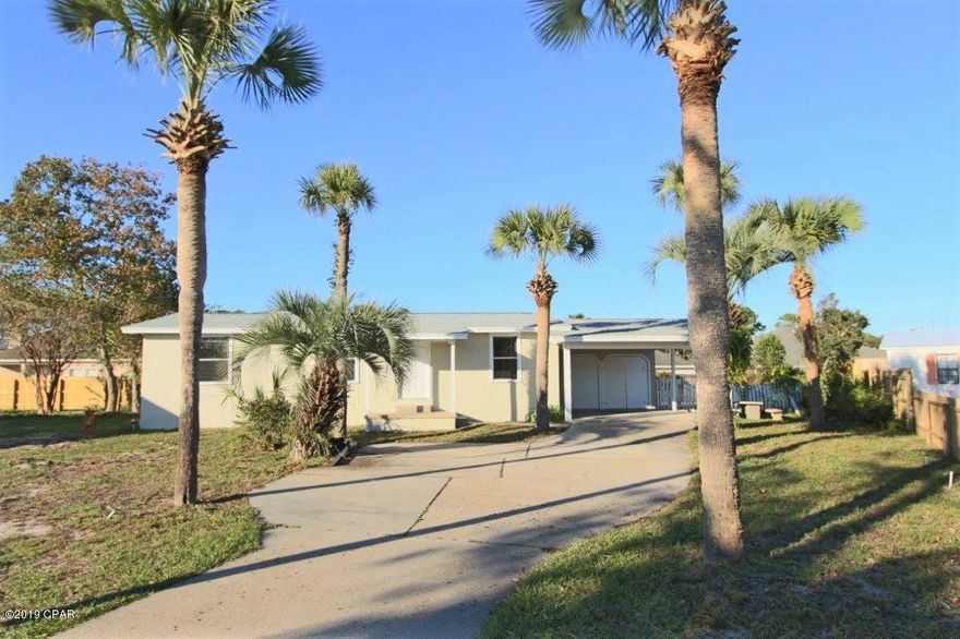 Nice home on Panama City Beach with new roof, floors, paint inside and out,and new HVAC. Large lot in the bend of street with mature landscaping. Covered back deck and carport including workshop.This is a open floor plan that offers a great deal for the money.All measurements and dimensions are approximate, survey and appraisal are recommended.Great location close to the Navy Base, elementary school, shopping and beach. Home features open floor plan, split bedroom design,cathedral ceilings, walk-in closets, nice large master bedroom. Large backyard and tons of room for parking.