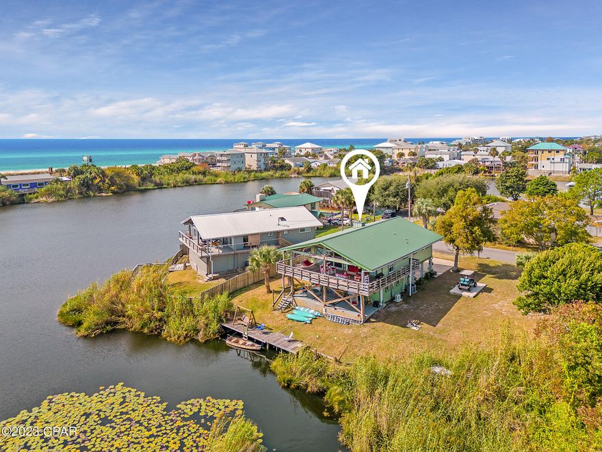 'CURRENTLY UNDER CONTRACT, SELLER WILL CONSIDER BACKUP OFFERS'. Wow, Lakefront Home with Expansive Gulf Views. This 3 bedroom 2 full bathroom lakefront beauty has huge covered balconies to enjoy the outdoors, as much as the inside. Even on the hottest of days, the sea-breeze coming off the lake makes it a super comfortable place to privately kick back and relax while taking in all the natural beauty that the lake and gulf views offer. If you like to fish, plenty of big fish have been caught right of the dock. The inside is pleasing and comfortable also. Metal roof over the beamed vaulted ceilings help make the open floor plan a grand space to share time with your family and friends. The nice flooring and finishes make this property ''turn key'' ready for your enjoyment. Known on the short term rental circuit as ''The ''Mermaid House'', this listing currently only includes the lot that the house is currently on. The vacant lot to the north of The Mermaid House can be included but that asking price has not been decided yet.  Currently, only The Mermaid House on one lot is being offered on the CPAR MLS. Previous Listing included extra lot to the north in the listing price. If buyer prospects are interested in the house and the extra lot, seller is interested in putting that deal together also. Please notice that the current PID includes both the house and the vacant lot. If important, it is the responsibility of the buyer or buyer's agent to verify measurements.