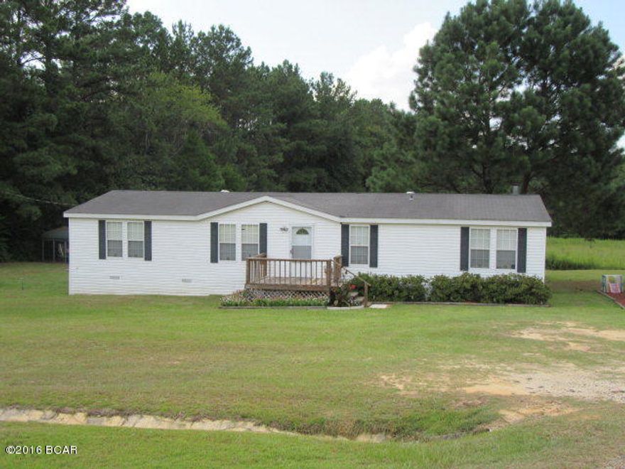 Very well kept home situated on 0.78 acres just South of Marianna and I-10. This home is very spacious with an open floor plan and 2 spacious living areas, one with a gas fireplace. Enjoy the country feel on this large deck overlooking pastureland, all with the convenience of being close to Marianna. The owners have updated the kitchen and bathroom flooring, and you'll love the split bedroom layout with a large master bedroom closet and bathroom with separate shower and tub.