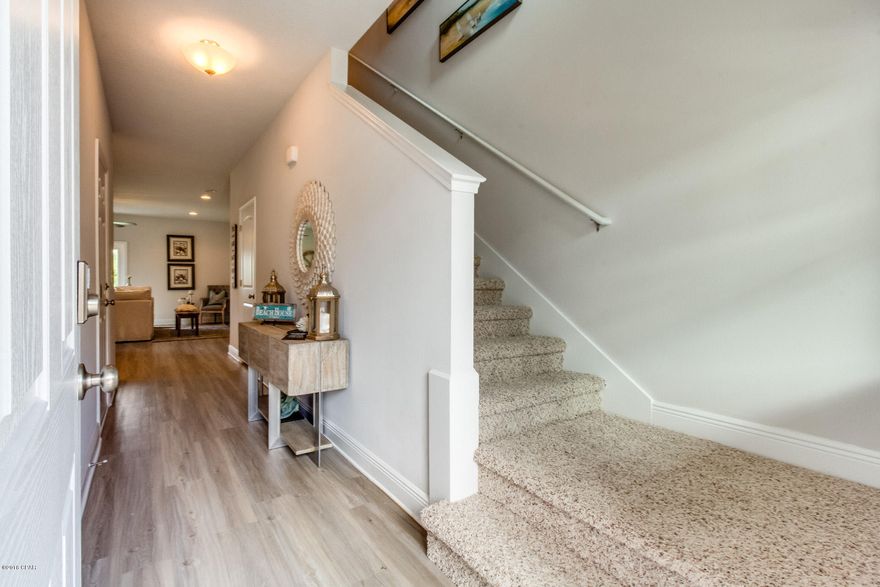 Only 1.5 miles from the beach! Tucked back in a charming community, but still close to everything, this newly built interior townhome offers 9' ceilings downstairs and 8' ceilings upstairs with Ivory cabinets, Azul Platino granite, and Washed Oak luxury vinyl plank flooring. An open and spacious floorplan with a huge master suite upstairs with a large walk-in closet and gorgeous master bath with high double sink vanity.