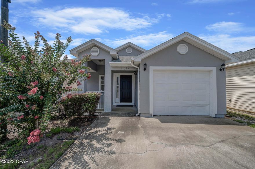 If you have been wanting a place in Panama City Beach, this cozy 3 Bedroom-2 bath home is ready for you in the Palm Cove Community.  Full time or Short term rentals are allowed and you will see the location is fabulous and near the sand and surf. It is one level and has a single garage . It also backs up to a green space and pond -- unlike most that back up to another home.  The seller has moved to another state and has left most of the furniture in the home for the new buyer.  There are two pools in the community to enjoy and the fees are reasonable at $449 per quarter. No yard maintenance is required and trash will be picked up at your door. The exterior was painted a few months ago, so make it a point to see this one.