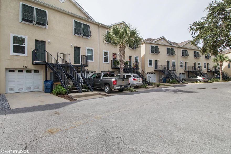 Reduced, best large water value on the market! Stunning views from this great condo on the Bay in downtown Panama City! What a great location! This townhouse actually has a large, 2 car garage with front and back openings! Fabulous bay views from the kitchen, living room, balcony and master bedroom!! The kitchen has custom cabinets and granite counter tops, new stainless dishwasher, stove and microwave! Main living area is on the second floor with a half bath. All carpet new and neutral, all freshly painted. Third floor has 2 bedrooms, each with it's own bathroom. The laundry room is also on the third floor. A brand new air conditioning system was installed. This unit is turn key and the best value on the Bay !