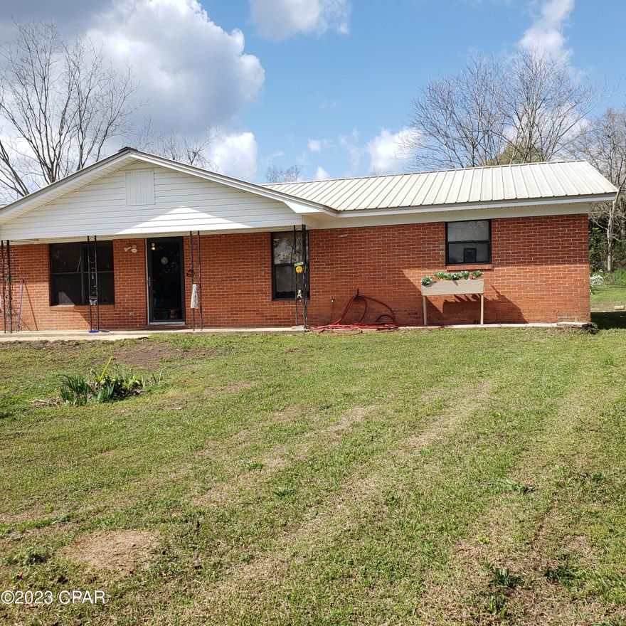 UNDER CONTRACT SELLER WILL CONSIDER BACKUPS  4 Bedroom 2.5 Bath Brick home on large lot in small town of Bonifay, Fl. Large living room. Eat in Kitchen. and a pantry. Large master bedroom and master bath with walk in Shower. Lots of built in storage.  Metal Roof in 2004 with hurricane clips.  Nice sized fenced yard. Nice and quiet  are and  Located on paved dead end road. Check it out today.