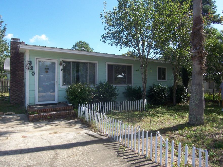 Charming beach cottage with vaulted, beamed wood ceilings throughout. Short walk or golf cart ride to the dedicated beach at the end of this street. Brick fireplace. New central heat/air. Tenant will stay or requires 60-day notice to vacate. Rent is $775/month. Washer and dryer are owned by the tenant.
