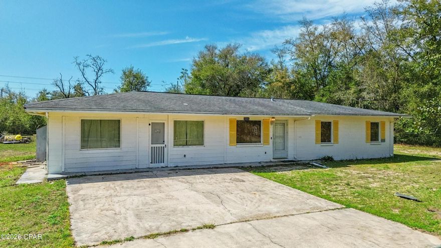 No HOA, 1 Acre of land, 4 bed 2.5 bath, block home!!! Discover the perfect blend of modern living and rural freedom in this well-maintained concrete block home, nestled on a peaceful, wooded one-acre lot in the heart of Bayou George. With no HOA restrictions, this property offers true independence, featuring a cleared area around the home ideal for parking boats or RVs, complemented by a back concrete patio and separate outbuildings for all your storage needs. The spacious 1,664+ square foot interior boasts an open-concept layout with four bedrooms, 2.5 bathrooms, and attractive hardwood-look tile flooring throughout. The chef-ready kitchen is equipped with a gas range, stainless steel appliances, and stylish barn doors, while a generous walk-in laundry room and gas tankless water heater add modern convenience. Key high-value extras include a private deep well with a Culligan water softener, a 250-gallon in-ground propane tank, and an active AC maintenance agreement with Peaden for added peace of mind. Located just a short drive from the boat ramps at Deer Point Lake and the amenities of Panama City via Highway 231, this move-in-ready gem is the ideal sanctuary for those seeking a wooded retreat with city accessibility. Schedule your showing today!