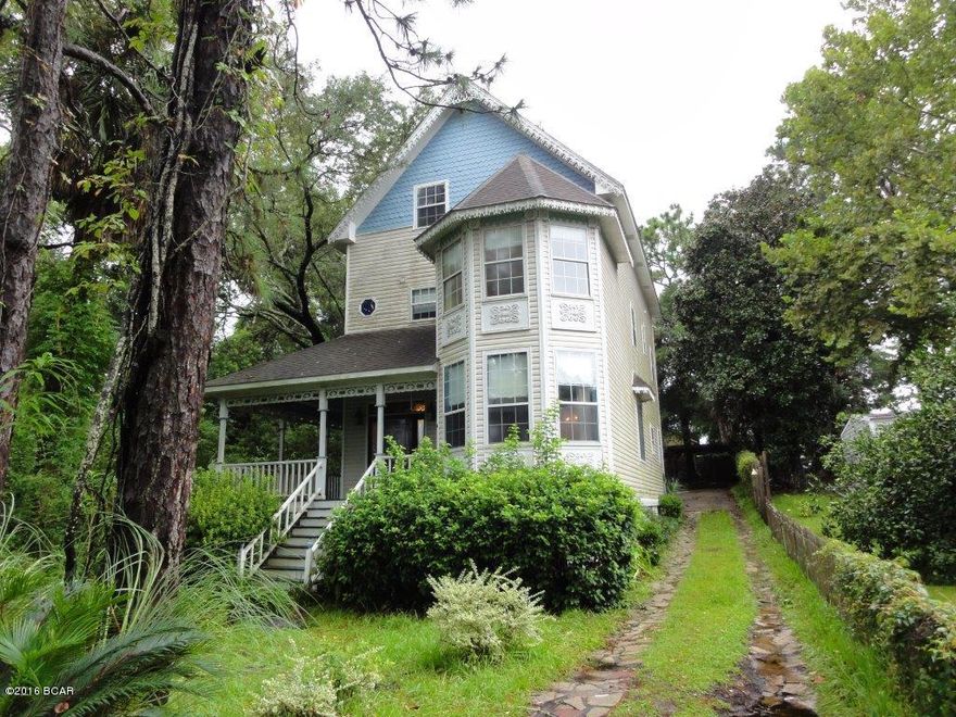 Beautiful, three story, Victorian style home in Bunkers Cove! Wrap-around rocking chair front porch! Formal living room & separate formal dining room! Both with hardwood floors! Family room with fireplace & built-in bookshelves! Kitchen features cherry cabinets & white appliances! Half bath on the main level! Huge master bedroom with walk in closets & sitting area! Private master bath with separate tub & shower! Three secondary bedrooms each with their own private bathroom! Spacious bonus room upstairs is a perfect playroom or rec room! Fenced yard! Work area, sink, & shelving in garage! Includes land directly across the street with boat dock! A must see! Please show & submit your offer today! All square footage noted is approximate.