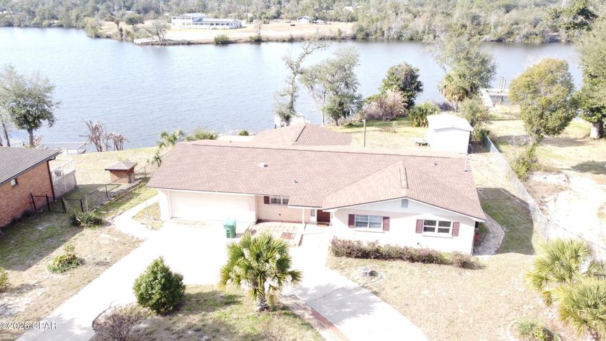 Have you ever wanted to live on the water with a nice sized yard and close to dining and shopping? If so, then this home is the one your looking for. With 4 spacious bedrooms and 2 bathrooms, almost a ½ acre lot, only 15-20 minutes from 23rd ST, and 10 minutes to Tyndall Air Force Base. Kitchen is spacious and offers plenty of cabinet space. Master bedroom offers double closets. You can slide right out the bedroom door onto the back deck where you can enjoy an afternoon looking over beautiful Lake Martin.The covered and screened back porch is the perfect place for all of the barbecue rain or shine. Down on the dock you can try your luck with some of those lunker bass that lurk in Lake Martin. HVAC replaced this year and roof  replaced in 2019.
