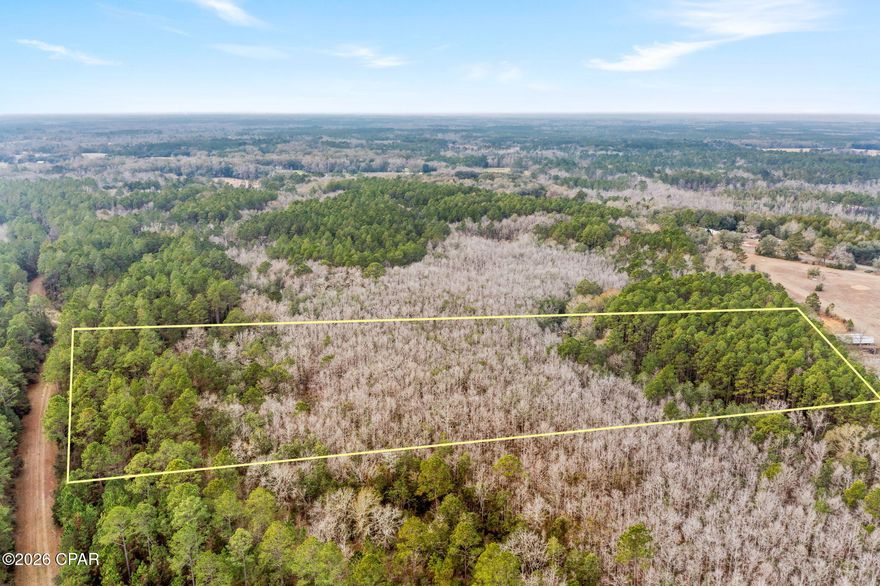 Nestled within the gated Holmes County community of Canopy Crossing, this 10 +/- acre tract provides an ideal blend of privacy and space for a custom home in a peaceful rural setting. Offering plenty of room to spread out, the property is well suited for those seeking quiet surroundings and the freedom that comes with owning acreage. The location offers both seclusion and convenience, with Interstate 10 just 15 minutes away and the sugar-white sands of Panama City Beach approximately 60 miles from the property. Outdoor enthusiasts will also appreciate close proximity to Vortex Springs, a well-known recreational destination. Whether building now or securing land for the future, this property presents a solid opportunity to own acreage in the Florida Panhandle.