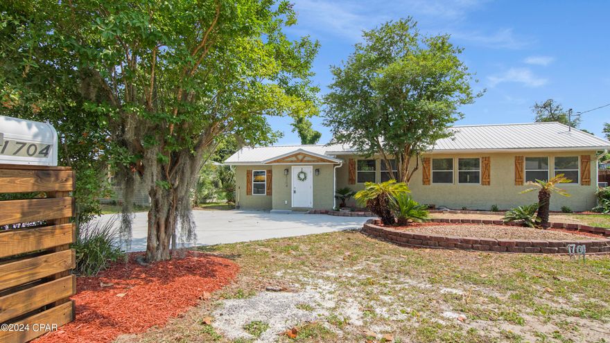 Charming Move-in ready 4 bed 2 bath home. This captivating home offers a perfect blend of classic charm and modern updates. The kitchen features sleek granite counter tops, stainless steel appliances, and crisp white cabinetry adorned with crown molding that completes this elegant look. Spread out and relax in the home's 1,774 sq ft of comfortable living space. Enjoy gatherings in the spacious living areas bathed in warm, recessed lighting. The primary bedroom in this home is the true definition of extra space and comfort accentuating its cathedral style ceiling. This delightful property boasts a sprawling .28-acre lot in the desirable Cove neighborhood. Unwind in the expansive backyard, perfect for barbecues, family fun, or creating your own personal green haven. A convenient storage outbuilding provides additional space for your outdoor essentials. Growing families, professionals seeking a peaceful retreat, or anyone seeking a spacious and stylish home in a sought-after neighborhood, this is the home for you. Don't miss this rare opportunity! Schedule your showing today!
