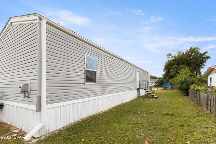 Recently Remodeled Mobile Home featuring LVP flooring, quartz countertops, recently installed kitchen cabinets and bathroom vanities.