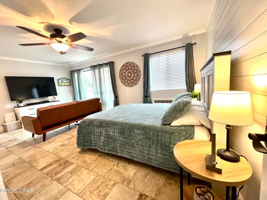 Welcome to Pirate's Cove. This quaint community offers beautiful views of Lake Powell where you can enjoy a day of jet skiing, kayaking and paddleboarding all the way to the gulf, a pier for a day of fishing, a  boat launch and two community pools. One of which is directly off of the patio and the other overlooks the lake. This cozy, first floor studio unit comes fully furnished and will be perfect for a rental or to call home. At Pirate's Cove, you are just a short commute to the beach, Camp Helen State Park and great shopping, dining and attractions that 30A and Panama City Beach offer. Don't miss out on this opportunity to own an affordable piece of paradise. Buyer to verify all information deemed important.