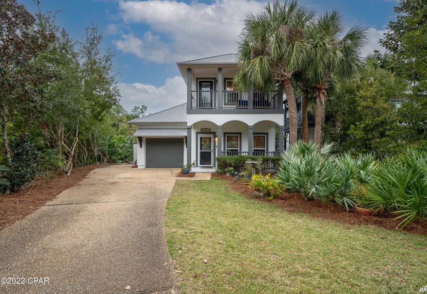 Beautiful home in prestigious gated community of Martinique. Features 3 Bdrms 2 full baths with one downstairs bedroom. Beautifully landscaped back yard with saltwater pool, a waterfall feature and paved patio area with covered porch and fenced in back yard. This community also has a very nice community pool, bath houses, a playground area, basketball and wonderful walking trails. This architecturally designed  gated community with so much natural landscaping has a mail center and  is located across the street from Grand Lagoon and a full service marina with boat storage and launch, upscale restaurants and walking distance to St. Andrews state park. It is a 5 min boat ride to the open Gulf waters.